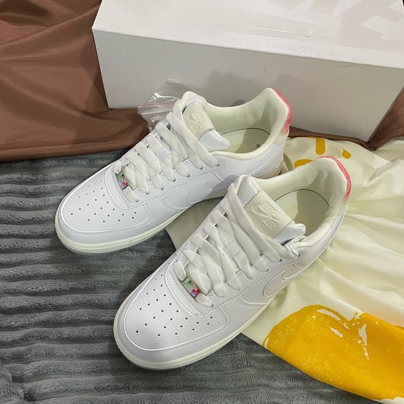 Nike Shoes - White Women's Low-Top Sneakers with Pink Heel Accent